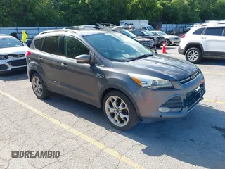 2013 Ford Escape Titanium with VIN 1FMCU0J98DUB32819, listed as a IAAI auction lot 42610813 with 266,569 mi miles and . Bid and sale history available at DreamBid. Image 1.