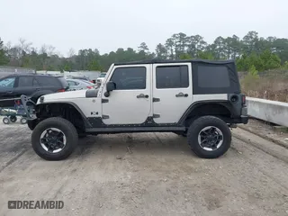 2007 Jeep Wrangler Unlimited X with VIN 1J4GA391X7L107424, listed as a IAAI auction lot 41752013 with 196,557 mi miles. Bid and sale history available at carsss.com. Image 14.