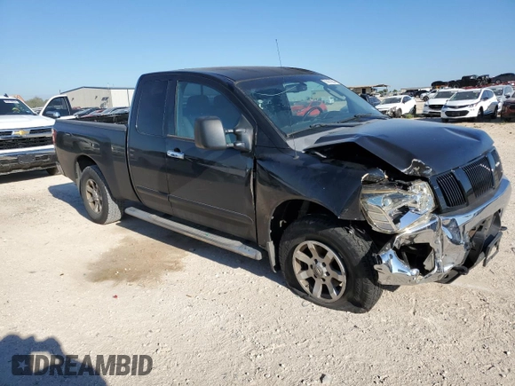 2006 Nissan Titan SE with VIN 1N6BA06B96N521452, listed as a Copart auction lot 70101084 with 197,101 mi miles and Salvage Title. Bid and sale history available at DreamBid. Image 4.