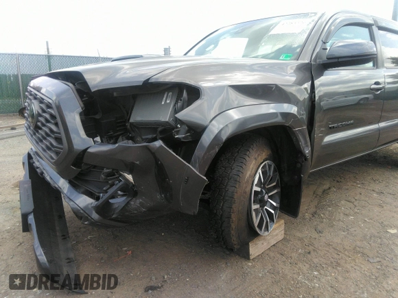 2021 Toyota Tacoma SR z VIN 3TYCZ5AN7MT017377, wystawiony jako IAAI lot #42285326 z przebiegiem 91 657 mil mil oraz . Historia ofert i sprzedaży dostępna na DreamBid. Obrazek 6.
