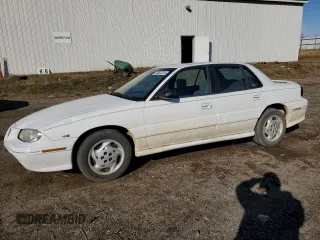 1997 Pontiac Grand Am SE with VIN 1G2NE52M4VM552724, listed as a Copart auction lot 75807324 with 77,515 mi miles and Clean title. Bid and sale history available at DreamBid. Image 1.