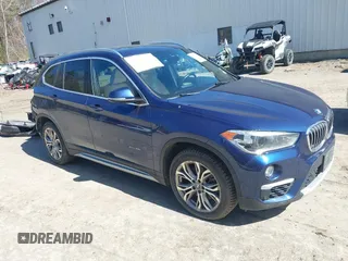 2017 BMW X1 xDrive28i with VIN WBXHT3C33H5F82035, listed as a IAAI auction lot 41944399 with 102,942 mi miles. Bid and sale history available at carsss.com. Image 1.