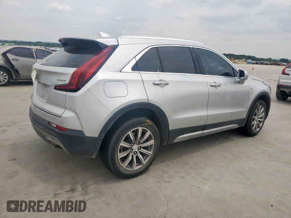 2021 Cadillac XT4 FWD Premium Luxury z VIN 1GYFZCR42MF004233, wystawiony jako Copart lot #57229385 z przebiegiem 98 387 mil mil oraz Szkody całkowita. Historia ofert i sprzedaży dostępna na DreamBid. Obrazek 3.