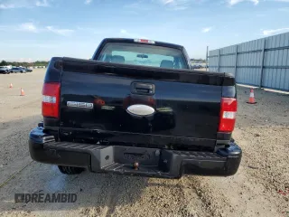 2007 Ford F-150 STX with VIN 1FTRF02297KD15057, listed as a Copart auction lot 73847974 with 184,413 mi miles and Salvage Title. Bid and sale history available at carsss.com. Image 6.