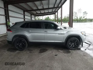 2023 Volkswagen Atlas SE z VIN 1V2HE2CA0PC222291, wystawiony jako IAAI lot #42431536 z przebiegiem 23 114 mil mil oraz . Historia ofert i sprzedaży dostępna na DreamBid. Obrazek 14.