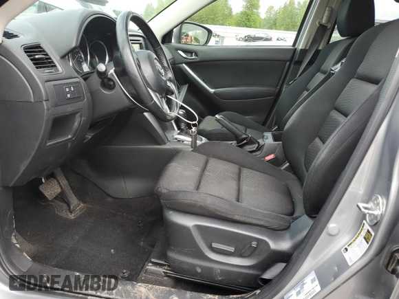 2014 Mazda CX-5 Touring z VIN JM3KE4CY0E0407169, wystawiony jako Copart lot #57877215 z przebiegiem 168 277 mil mil oraz Szkoda całkowita • Salvage title. Historia ofert i sprzedaży dostępna na DreamBid. Obrazek 7.