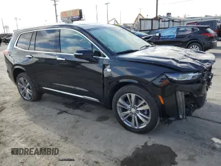 2023 Cadillac XT6 FWD Premium Luxury with VIN 1GYKPCRS9PZ117215, listed as a Copart auction lot 71242714 with 29,162 mi miles and Salvage Title. Bid and sale history available at carsss.com. Image 4.