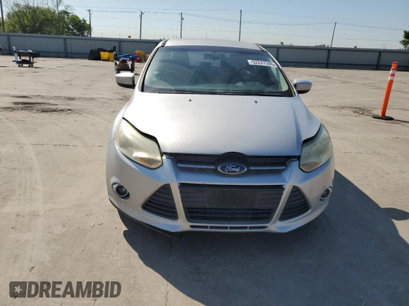 2012 Ford Focus SE z VIN 1FAHP3F23CL174243, wystawiony jako Copart lot #52247595 z przebiegiem 164 383 mil mil oraz Czysty tytuł • Clean title. Historia ofert i sprzedaży dostępna na DreamBid. Obrazek 5.