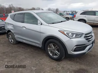 2018 Hyundai Santa Fe 2.4L z VIN 5XYZTDLB6JG526390, wystawiony jako IAAI lot #42027422 z przebiegiem 141 861 mil mil oraz . Historia ofert i sprzedaży dostępna na DreamBid. Obrazek 1.