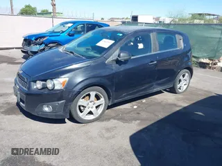 2015 Chevrolet Sonic LTZ with VIN 1G1JE6SB8F4116693, listed as a IAAI auction lot 42865997 with 102,961 mi miles and . Bid and sale history available at DreamBid. Image 2.