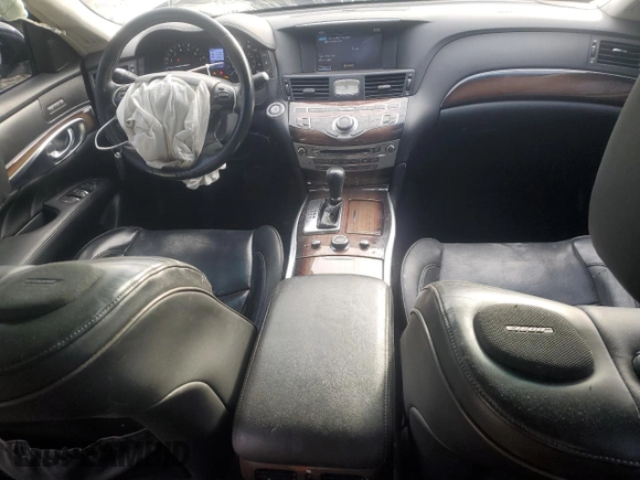 2016 Infiniti Q70 with VIN JN1BY1PR2GM721261, listed as a Copart auction lot 83307734 with 175,027 mi miles and Salvage title. Bid and sale history available at DreamBid. Image 8.