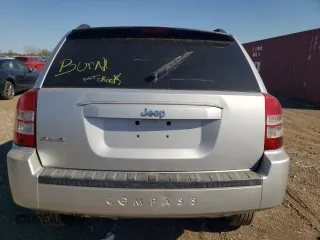 2010 Jeep Compass Sport with VIN 1J4NF4FB1AD672772, listed as a Copart auction lot 74220304 with 0 mi miles and Salvage Title. Bid and sale history available at carsss.com. Image 6.