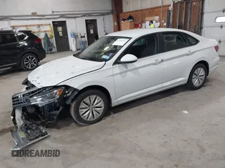 2019 Volkswagen Jetta S z VIN 3VWC57BU6KM129512, wystawiony jako IAAI lot #42205228 z przebiegiem 92 940 mil mil oraz . Historia ofert i sprzedaży dostępna na DreamBid. Obrazek 16.