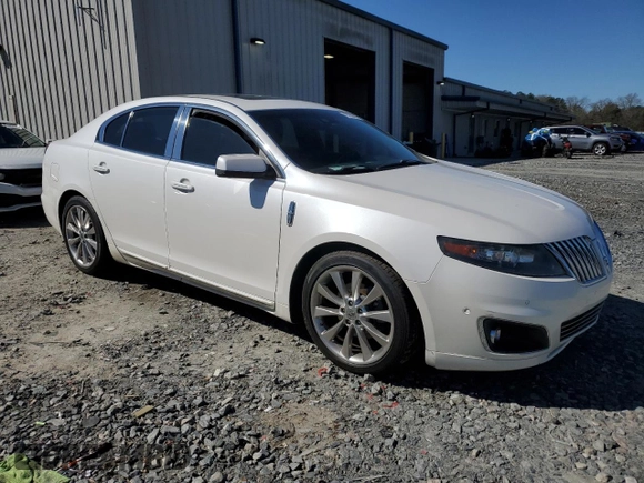 2011 Lincoln MKS EcoBoost with VIN 1LNHL9FT7BG611097, listed as a Copart auction lot 48180885 with 140,262 mi miles and Salvage title. Bid and sale history available at DreamBid. Image 4.