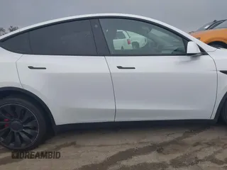 2022 Tesla Model Y Performance with VIN 7SAYGDEF0NF400560, listed as a IAAI auction lot 41783912 with 36,513 mi miles and . Bid and sale history available at DreamBid. Image 13.