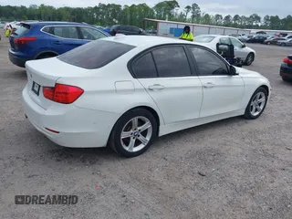 2015 BMW 3 Series 328i with VIN WBA3A5C50FF608327, listed as a IAAI auction lot 42136156 with 213,945 mi miles. Bid and sale history available at carsss.com. Image 4.