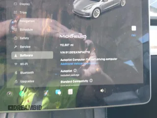 2022 Tesla Model 3 with VIN 5YJ3E1EA1NF142713, listed as a IAAI auction lot 42027630 with 112,557 mi miles. Bid and sale history available at carsss.com. Image 7.