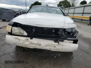1997 Ford Mustang z VIN 1FALP4049VF169429, wystawiony jako Copart lot #59153175 z przebiegiem 134 454 mil mil oraz Szkoda całkowita • Salvage title. Historia ofert i sprzedaży dostępna na DreamBid. Obrazek 5.