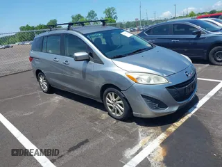 2012 Mazda 5 Sport z VIN JM1CW2BL1C0112647, wystawiony jako IAAI lot #42508246 z przebiegiem 170 765 mil mil oraz . Historia ofert i sprzedaży dostępna na DreamBid. Obrazek 1.