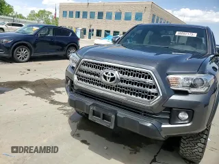 2017 Toyota Tacoma SR5 z VIN 3TMCZ5AN6HM060416, wystawiony jako Copart lot #56697175 z przebiegiem 120 029 mil mil oraz Szkoda całkowita • Salvage title. Historia ofert i sprzedaży dostępna na DreamBid. Obrazek 13.