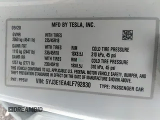 2020 Tesla Model 3 Standard Range Plus with VIN 5YJ3E1EA4LF792830, listed as a IAAI auction lot 41852919 with 76,461 mi miles. Bid and sale history available at carsss.com. Image 9.