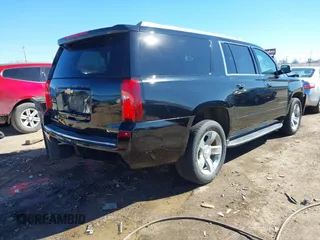 2018 Chevrolet Suburban Premier z VIN 1GNSCJKC5JR386545, wystawiony jako IAAI lot #41684349 z przebiegiem 130 511 mil mil oraz . Historia ofert i sprzedaży dostępna na DreamBid. Obrazek 4.