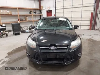 2014 Ford Focus Titanium with VIN 1FADP3J22EL199563, listed as a IAAI auction lot 41450106 with 129,271 mi miles. Bid and sale history available at carsss.com. Image 12.