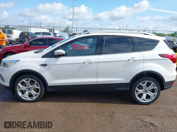 2019 Ford Escape Titanium with VIN 1FMCU9J98KUA95238, listed as a IAAI auction lot 42525324 with 59,222 mi miles and . Bid and sale history available at DreamBid. Image 14.