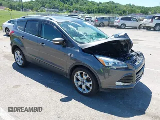 2015 Ford Escape Titanium z VIN 1FMCU9J92FUB01007, wystawiony jako IAAI lot #42319246 z przebiegiem 90 782 mil mil oraz . Historia ofert i sprzedaży dostępna na DreamBid. Obrazek 1.