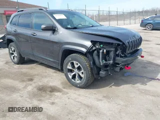 2015 Jeep Cherokee Trailhawk z VIN 1C4PJMBS3FW520328, wystawiony jako IAAI lot #41746017 z przebiegiem 83 485 mil mil oraz . Historia ofert i sprzedaży dostępna na DreamBid. Obrazek 1.