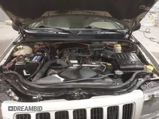 2004 Jeep Grand Cherokee Laredo with VIN 1J4GW48S44C321869, listed as a IAAI auction lot 41822099 with 181,663 mi miles. Bid and sale history available at carsss.com. Image 10.