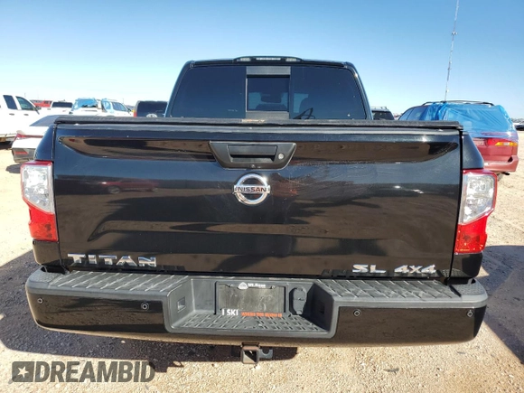 2017 Nissan Titan SL z VIN 1N6AA1E54HN554049, wystawiony jako Copart lot #81404094 z przebiegiem 97 811 mil mil oraz Czysty tytuł • Clean title. Historia ofert i sprzedaży dostępna na DreamBid. Obrazek 6.