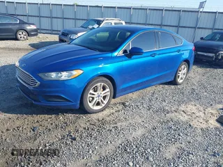 2018 Ford Fusion SE z VIN 3FA6P0H7XJR106776, wystawiony jako IAAI lot #42243361 z przebiegiem 174 000 mil mil oraz . Historia ofert i sprzedaży dostępna na DreamBid. Obrazek 2.