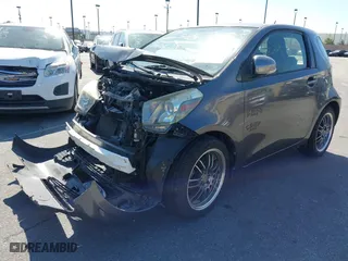 2012 Scion iQ with VIN JTNJJXB07CJ017296, listed as a IAAI auction lot 41636769 with 94,333 mi miles. Bid and sale history available at carsss.com. Image 2.