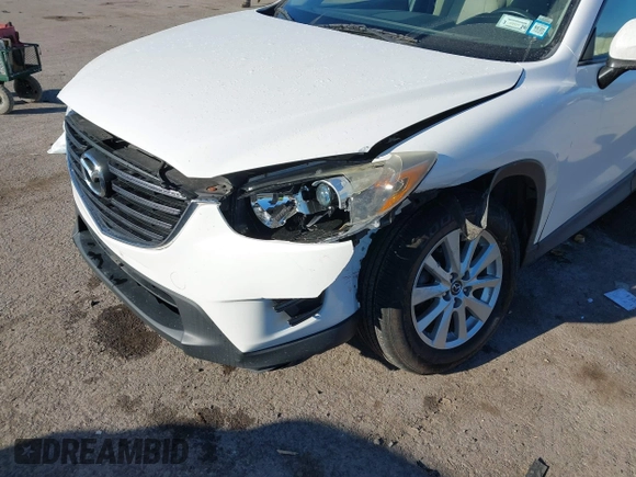2016 Mazda CX-5 Sport with VIN JM3KE4BY8G0605504, listed as a IAAI auction lot 41866173 with 91,797 mi miles. Bid and sale history available at carsss.com. Image 6.