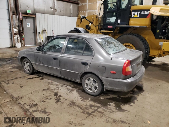 2000 Hyundai Accent z VIN KMHCG45G4YU090520, wystawiony jako Copart lot #79705864 z przebiegiem 145 490 mil mil oraz Szkoda całkowita • Salvage title. Historia ofert i sprzedaży dostępna na DreamBid. Obrazek 2.
