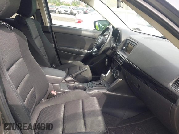 2014 Mazda CX-5 Touring z VIN JM3KE4CY2E0348500, wystawiony jako IAAI lot #42318155 z przebiegiem 182 616 mil mil oraz . Historia ofert i sprzedaży dostępna na DreamBid. Obrazek 5.
