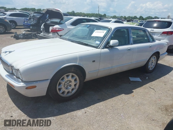 2003 Jaguar XJ 8 with VIN SAJDA14C03LF52338, listed as a IAAI auction lot 42684038 with 142,107 mi miles and . Bid and sale history available at DreamBid. Image 2.