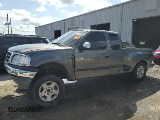 2002 Ford F-150 with VIN 2FTRX17W82CA68786, listed as a Copart auction lot 71484684 with 212,712 mi miles and Salvage Title. Bid and sale history available at DreamBid. Image 1.