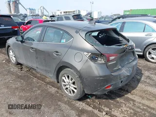 2014 Mazda 3 i Grand Touring with VIN JM1BM1M75E1207754, listed as a IAAI auction lot 41698583 with 128,887 mi miles and . Bid and sale history available at DreamBid. Image 3.