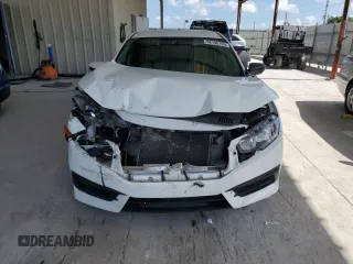 2017 Honda Civic LX z VIN 19XFC2F57HE044404, wystawiony jako Copart lot #58196105 z przebiegiem 117 664 mil mil oraz Szkoda całkowita • Salvage title. Historia ofert i sprzedaży dostępna na DreamBid. Obrazek 5.