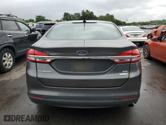 2017 Ford Fusion SE z VIN 3FA6P0HDXHR122962, wystawiony jako Copart lot #64964565 z przebiegiem 139 005 mil mil oraz Czysty tytuł • Clean title. Historia ofert i sprzedaży dostępna na DreamBid. Obrazek 6.