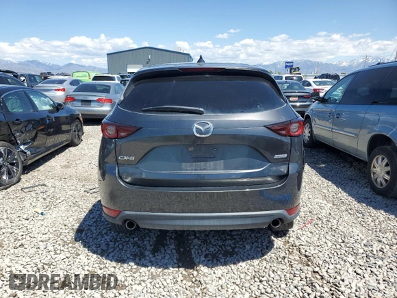 2018 Mazda CX-5 Touring z VIN JM3KFACM5J0338126, wystawiony jako Copart lot #56185795 z przebiegiem 115 254 mil mil oraz Szkoda całkowita • Salvage title. Historia ofert i sprzedaży dostępna na DreamBid. Obrazek 6.