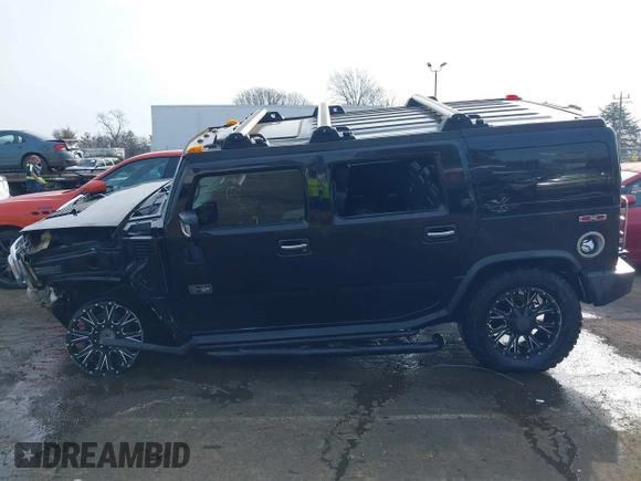 2006 Hummer H2 with VIN 5GRGN23U06H113353, listed as a IAAI auction lot 41476649 with 165,370 mi miles. Bid and sale history available at carsss.com. Image 14.