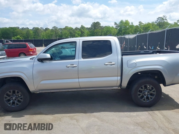 2023 Toyota Tacoma SR with VIN 3TYCZ5AN4PT149730, listed as a IAAI auction lot 42083146 with 31,731 mi miles and . Bid and sale history available at DreamBid. Image 14.
