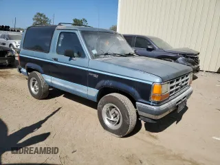 1990 Ford Bronco z VIN 1FMCU12T2LUA31399, wystawiony jako Copart lot #77099614 z przebiegiem 85 663 mil mil oraz Szkoda całkowita • Salvage title. Historia ofert i sprzedaży dostępna na DreamBid. Obrazek 4.