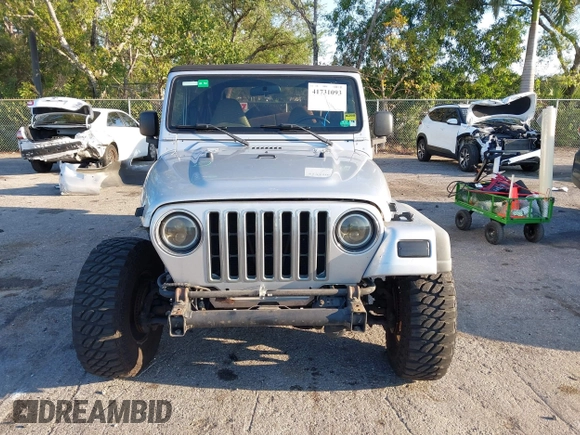 2005 Jeep Wrangler Unlimited with VIN 1J4FA44S65P335444, listed as a IAAI auction lot 41731093 with 143,918 mi miles. Bid and sale history available at carsss.com. Image 12.
