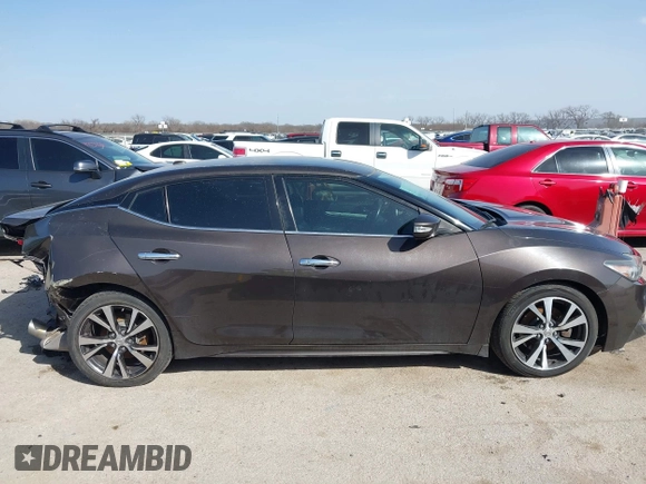 2016 Nissan Maxima Platinum with VIN 1N4AA6AP2GC385723, listed as a IAAI auction lot 41753328 with 162,845 mi miles and . Bid and sale history available at DreamBid. Image 13.