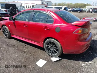 2011 Mitsubishi Lancer ES with VIN JA32U2FU3BU036133, listed as a IAAI auction lot 41970838 with 142,838 mi miles. Bid and sale history available at carsss.com. Image 3.