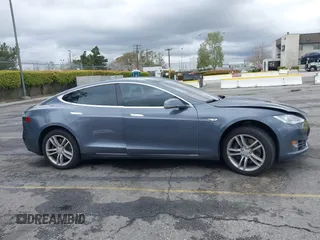 2013 Tesla Model S with VIN 5YJSA1CN8DFP21869, listed as a IAAI auction lot 41772603 with Not provided miles and . Bid and sale history available at DreamBid. Image 12.